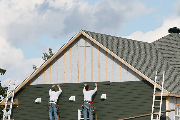 Professional Storm Damage Siding Repair technician working in Lumberton, NC
